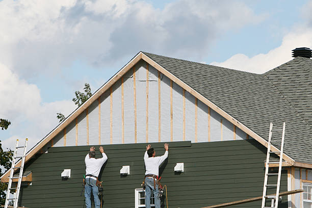 Professional Siding technician working in White Hall, WV